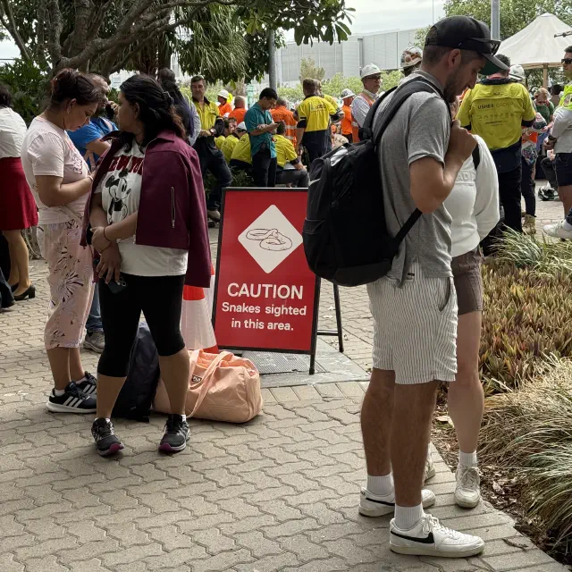 Evacuation area - sign saying caution, snakes sighted in this area