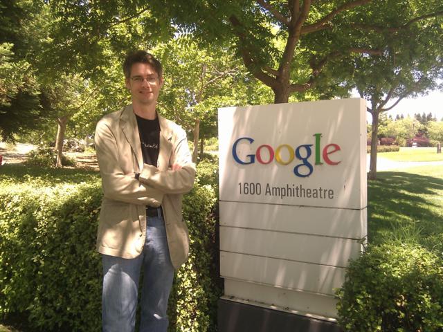 There I am next to a messy Google sign